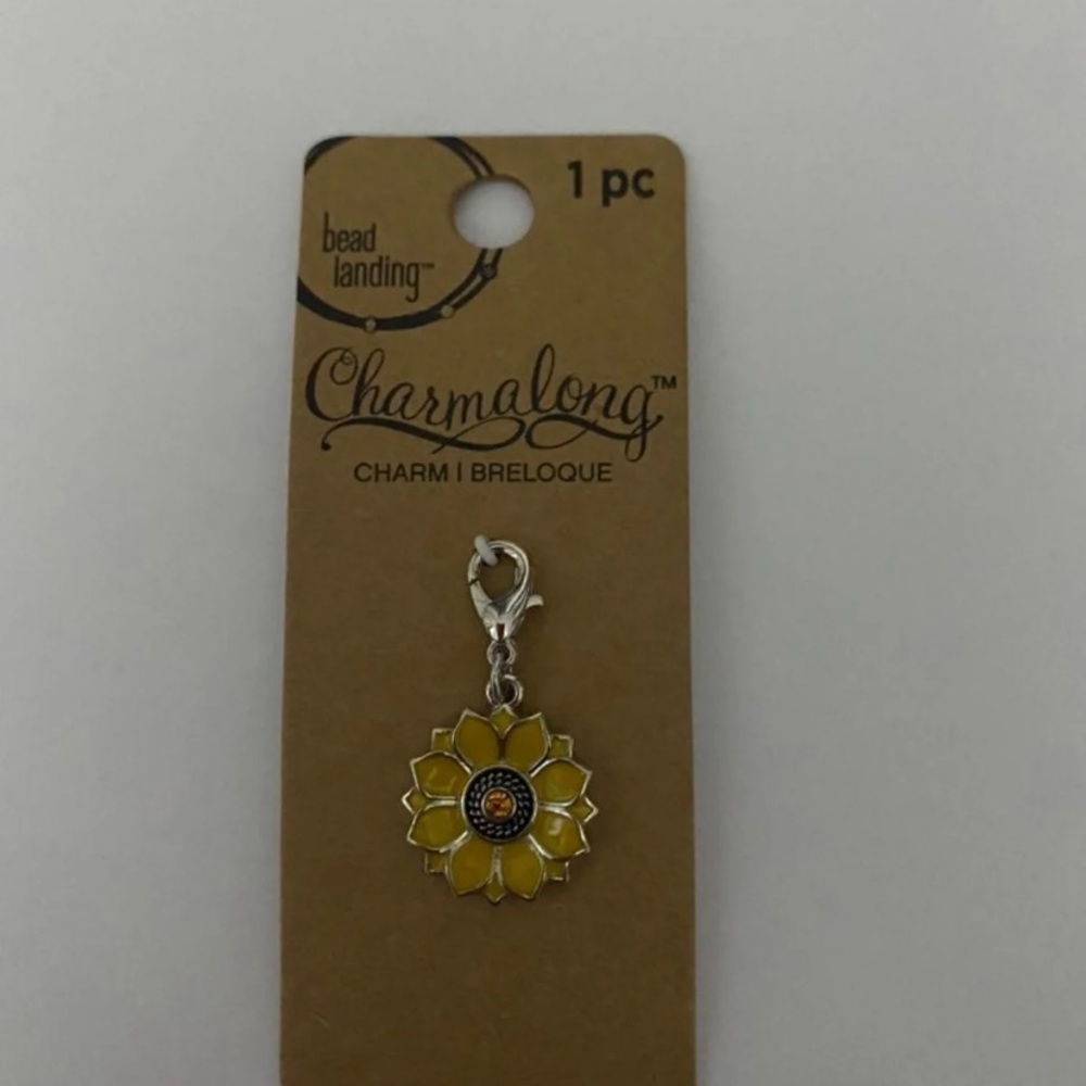 A clip of a sunflower charm.